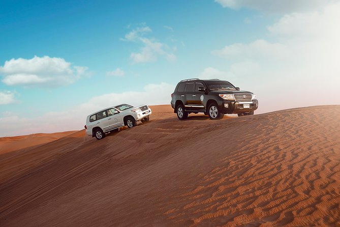 Desert Safari Dubai With Dune Bashing, Sandboarding, Camel Ride, 5 Shows, Dinner - Conquer the Sand With Sandboarding