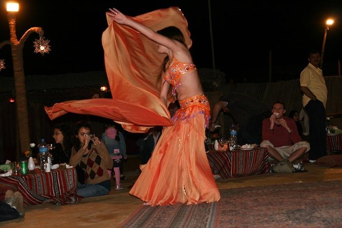 Dubai Red Sand Safari With BBQ Dinner, Sandboard, Camel Ride - Indulging in a Delicious BBQ Dinner