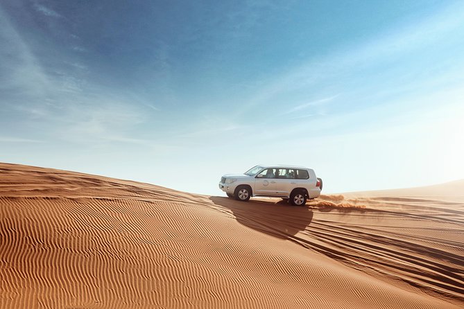 Desert Safari Dubai With Dune Bashing, Sandboarding, Camel Ride, 5 Shows, Dinner - Indulge in a Delicious Dinner Under the Desert Sky