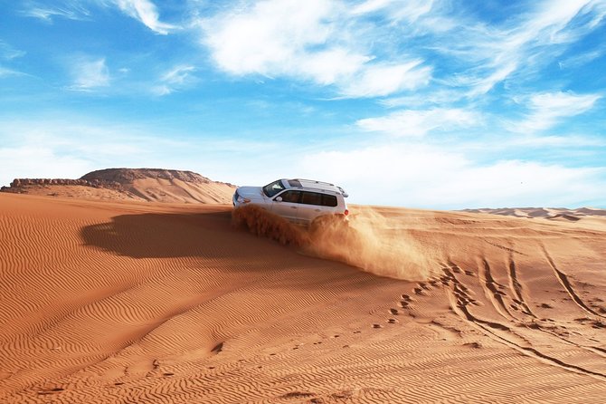 Dubai Red Dune Safari With Quad Bike, Sandboard & Camel Ride - Thrilling Dune Bashing Session in a 4x4 Vehicle